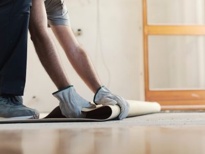 Contractor removing an old linoleum flooring